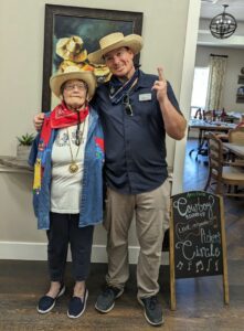 Alexis Pointe of Wimberley | Maintenance Director with a senior resident dressed as cowboys