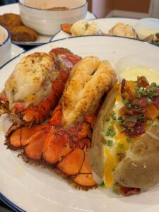 Arabella of Athens | Cooked lobster on a white plate