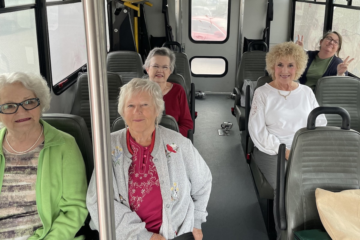 Cambridge Court | Senior residents on a shuttle