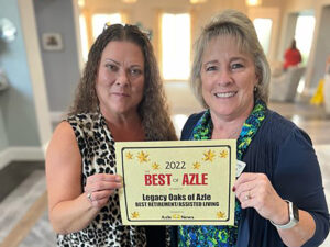 Legacy Oaks of Azle | Two women holding up award