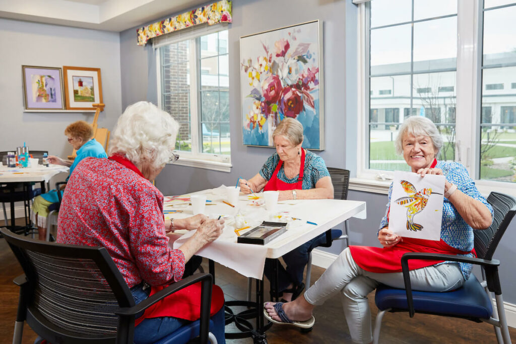 The Grand | Senior women painting together at an art table