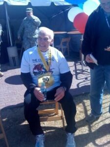 The Grandview of Chisholm Trail | Senior man, Ted Brewer, sitting and smiling after running