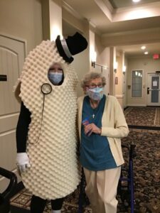 Civitas Senior Living | Happy senior and a man dressed as a peanut