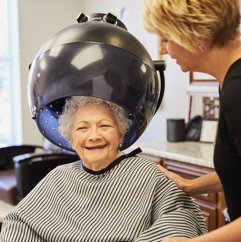 Alexis Pointe of Wimberley | Senior woman sitting under the hair dryer in the salon