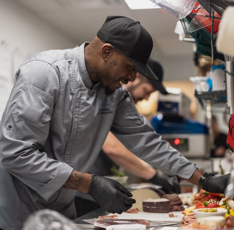 Alexis Point of Wimberley | Dining service member preparing food