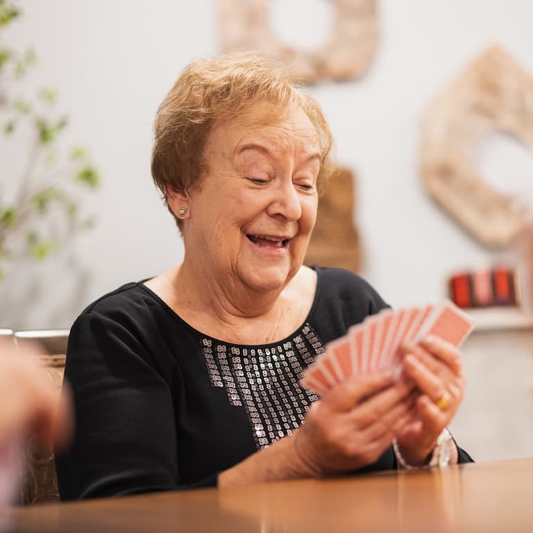 Alexis Point of Wimberley | Senior woman playing cards