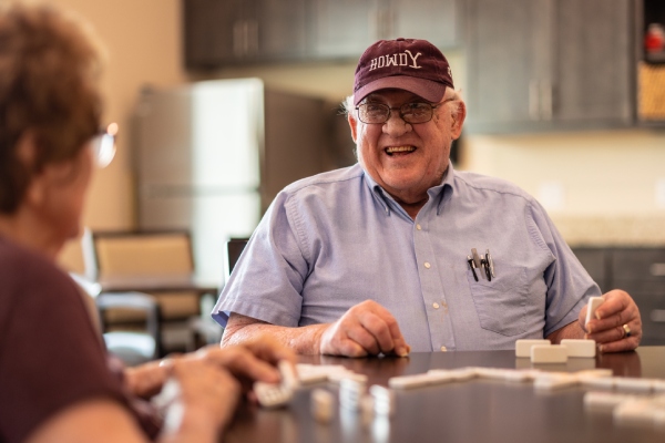 Civitas Senior Living | Seniors laughing and playing a game