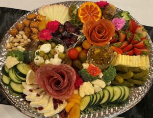 Arabella of Athens | Overhead shot of a charcuterie board with cheeses and meats and vegatables