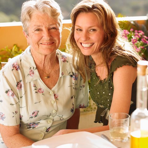 Arabella of Longview | Senior woman and her daughter having wine