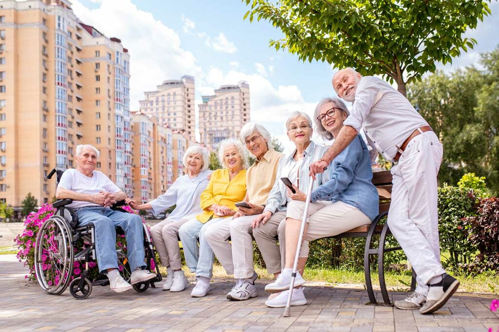 Arabella of Longview | Seniors in the park sitting on a bench together