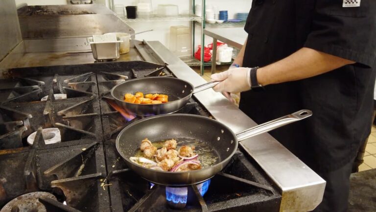 Arabella of Longview | Food and Beverage Director and Executive Chef Axel Rodriguez preparing food for residents