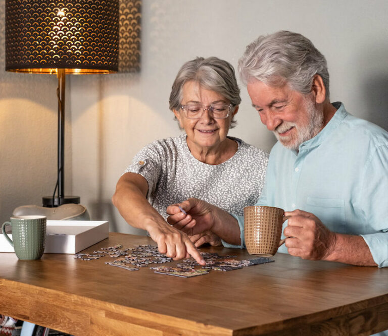 Arabella of Red Oak | Two happy seniors doing a puzzle together