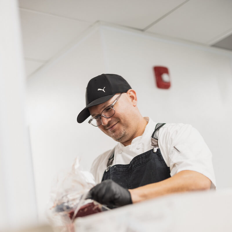 Arabella of Red Oak | Chef preparing food for residents