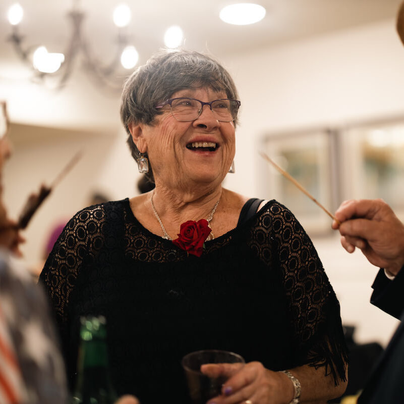 Arabella of Red Oak | Senior woman smiling at event