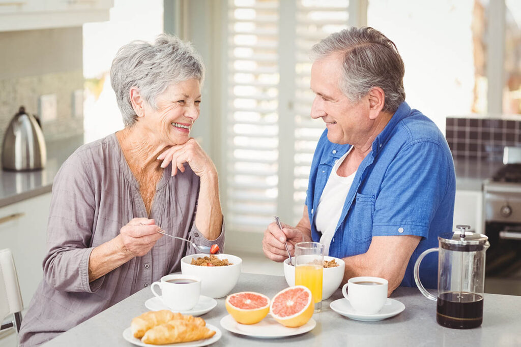 Arabella of Red Oak | Two happy seniors eating breakfast