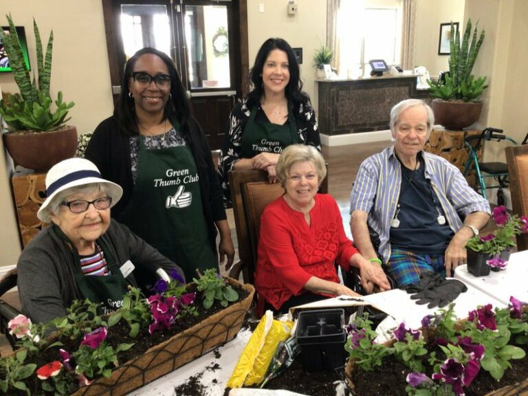 Arabella of Red Oak | Community members and caregivers gardening