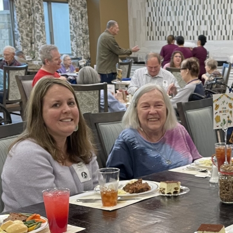 Ariel Pointe of Sachse | Senior woman and family member smiling at event