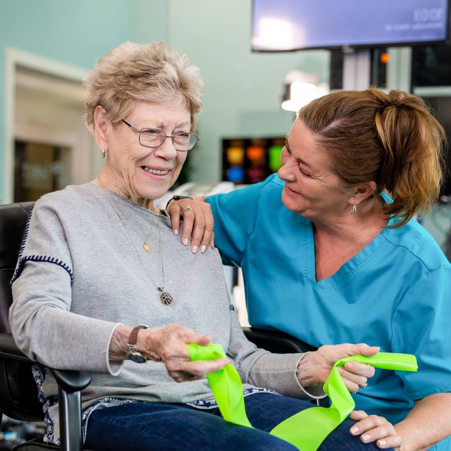 Ariel Pointe of Sachse | Resident smiling with caregiver