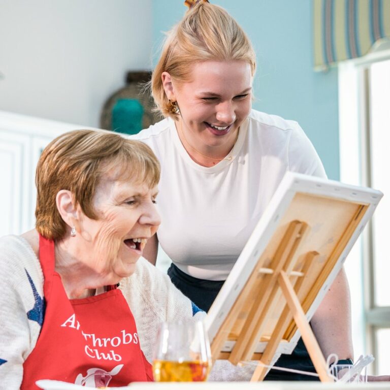 Ariel Pointe of Sachse | Resident Painting with caregiver