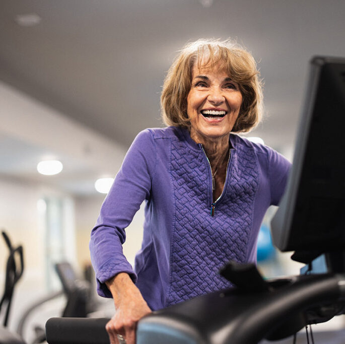 Autumn Wind | Senior woman on elliptical