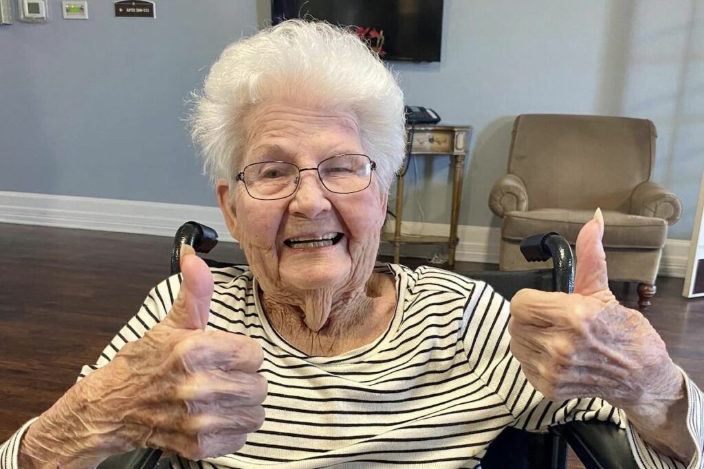 Autumn Wind | Mineola senior resident giving two thumbs up