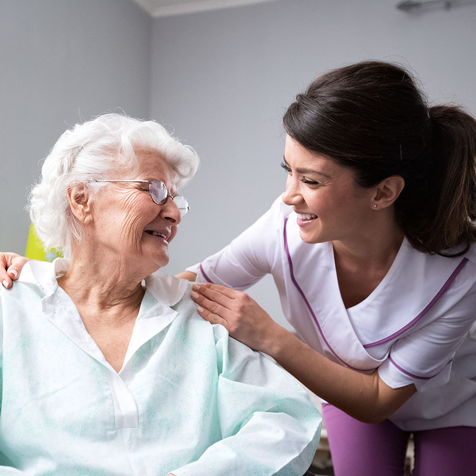 Cambridge Court | Satisfied and happy senior woman patient with nurse