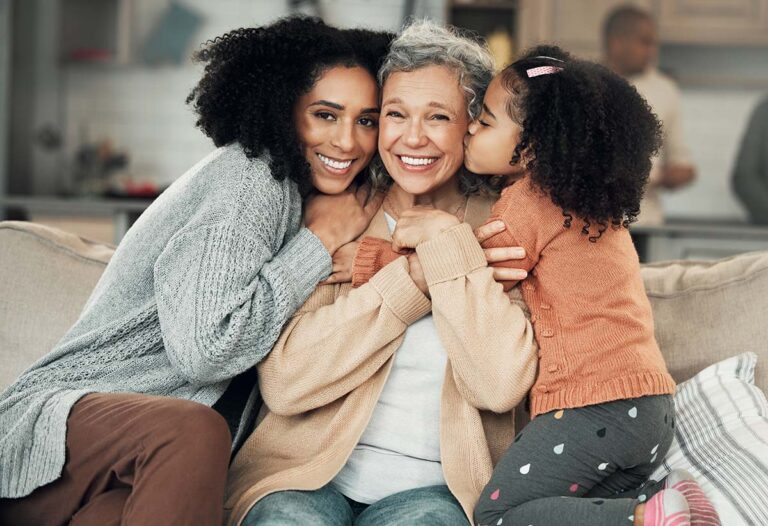 Clear Fork | Senior woman and her family hugging.