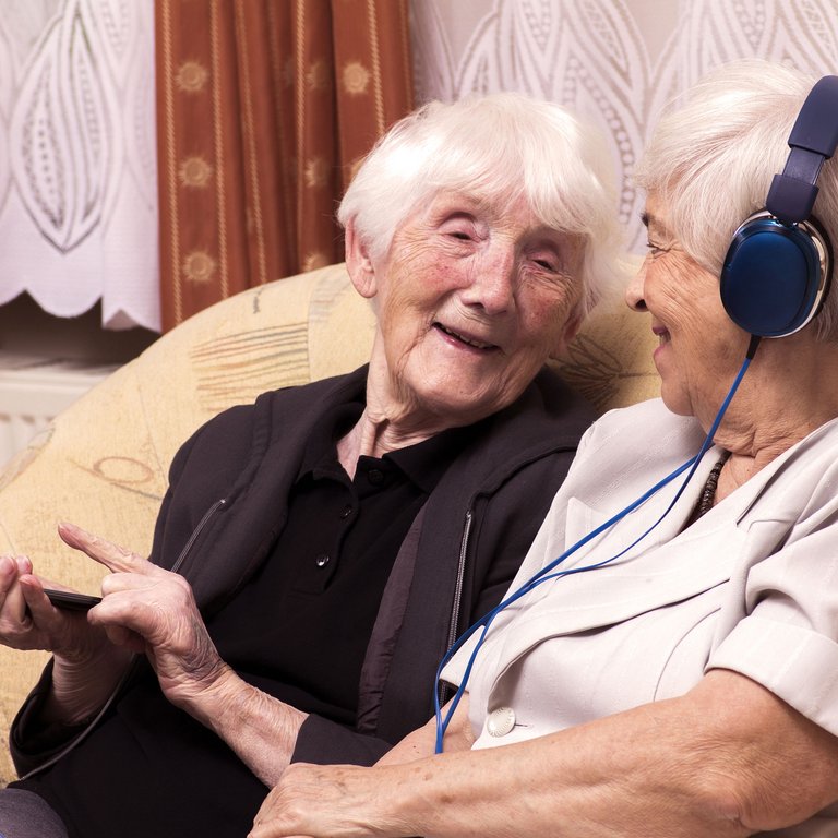Double Creek | Senior women listening to music