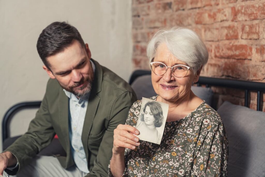 Double Creek | Senior sharing her self-portrait with family member