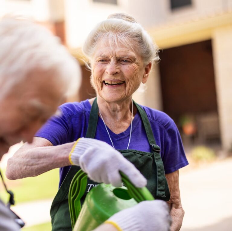 Double Creek | Seniors watering flowers together Green Thumb Club