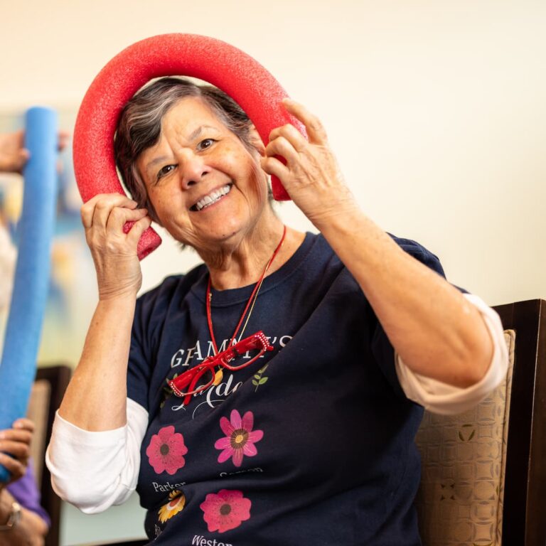 Double Creek | Woman having fun in chair exercise class