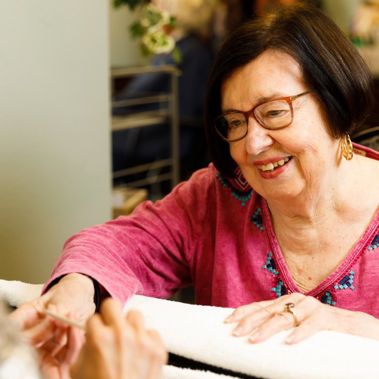 Élan Manatee | Senior woman getting manicure