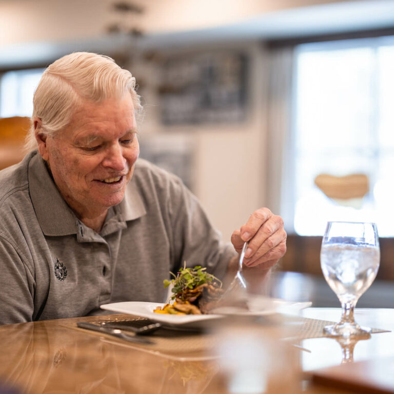 Élan Westpointe | Senior man enjoying chef-prepared meal - fine dining new braunfels