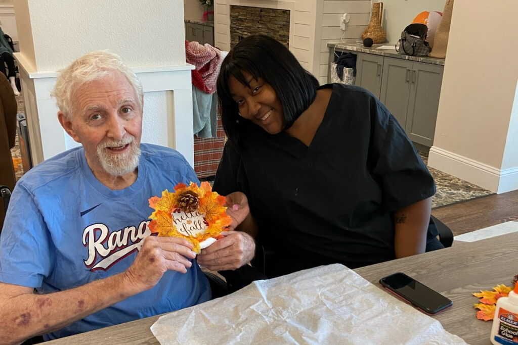 Harvest of Aledo | Senior and caretaker making crafts