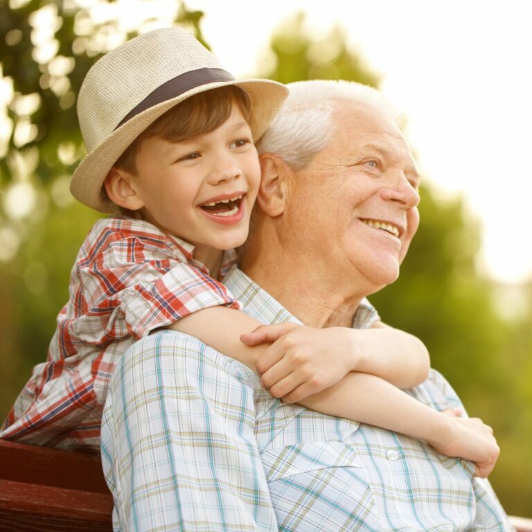 Harvest of Roanoke | Senior man holding grandson