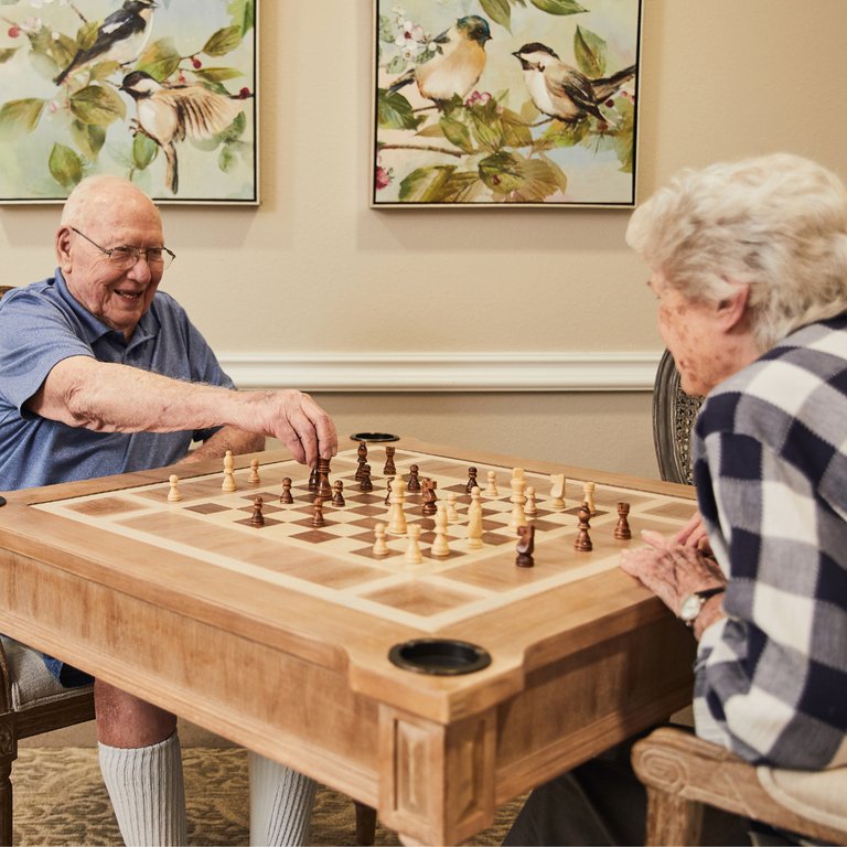 Ledgestone Senior Living | Senior couple playing chess