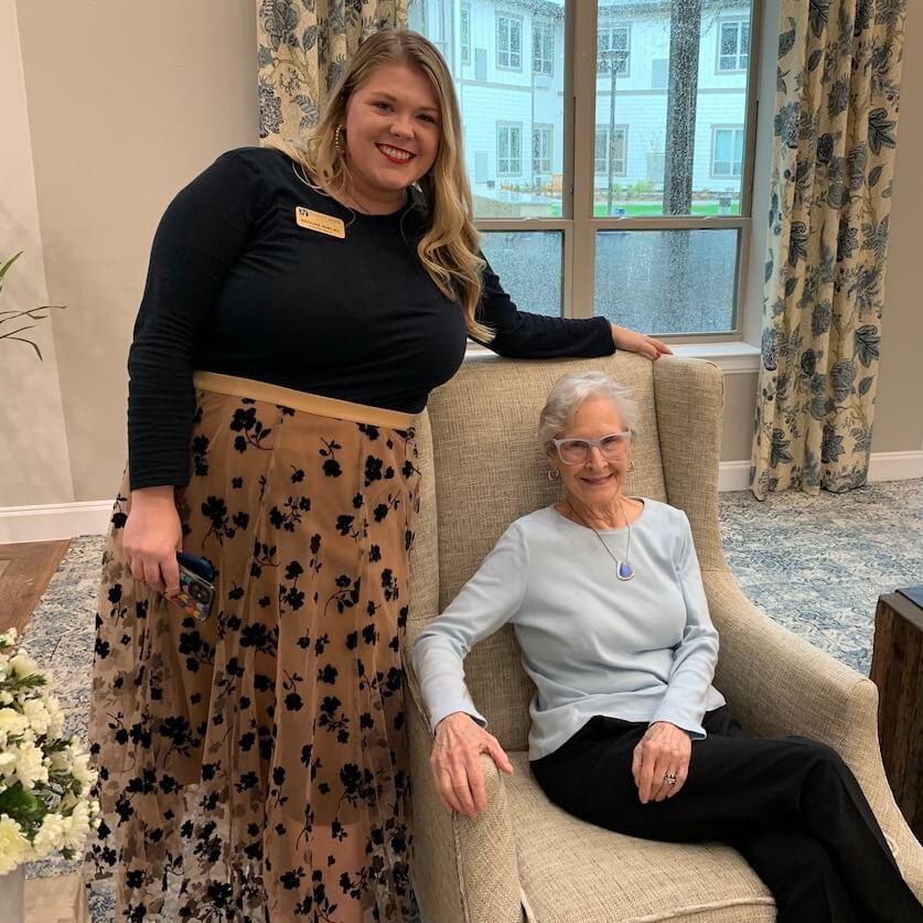 Ledgestone Senior Living | Senior resident standing with one of her caregivers