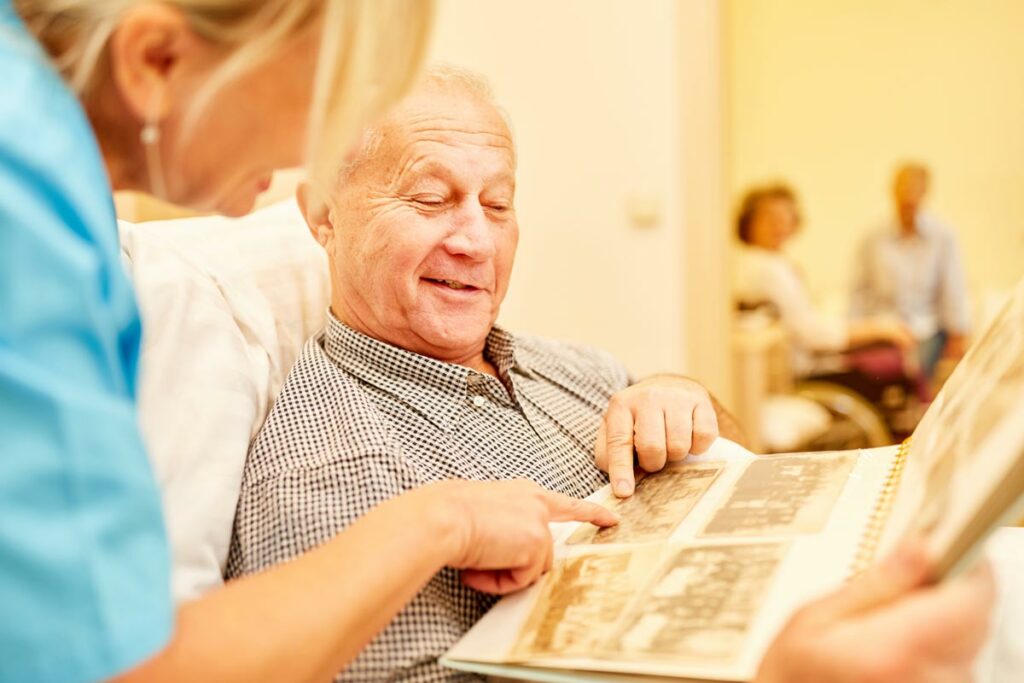Ledgestone Senior Living | Senior man receiving Alzheimer’s Care from his caregiver in Austin, TX