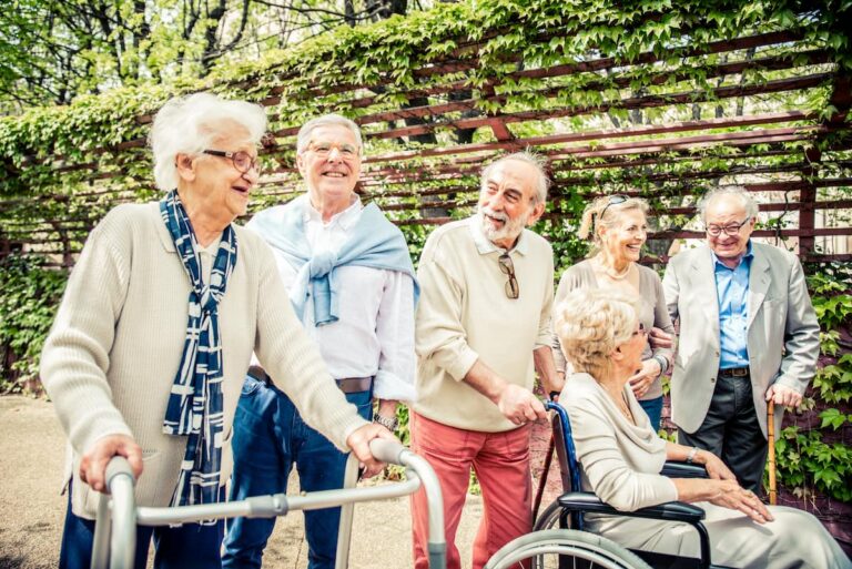 Ledgestone | Seniors with disabilities walking and laughing together