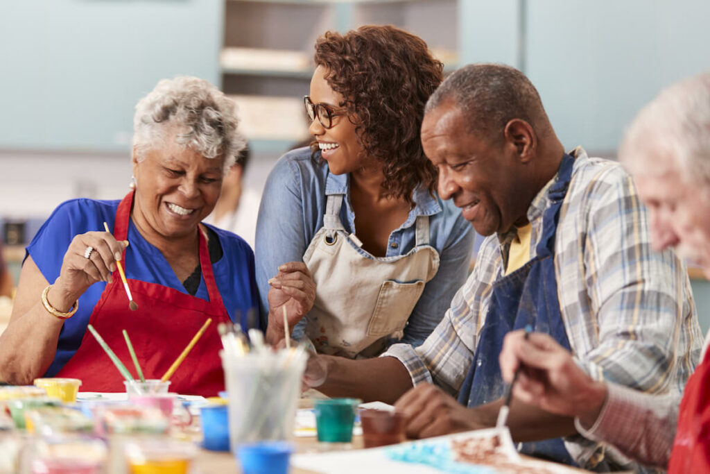 Civitas Senior Living | Senior couple painting with their daughter