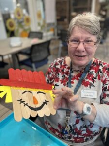 Legazy Oaks of Azle | Vicki showing off her painting