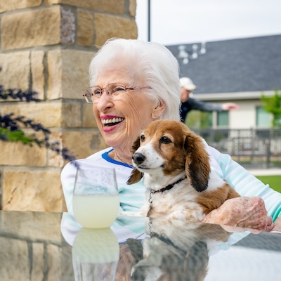 Civitas Senior Living | Senior resident holding her dog