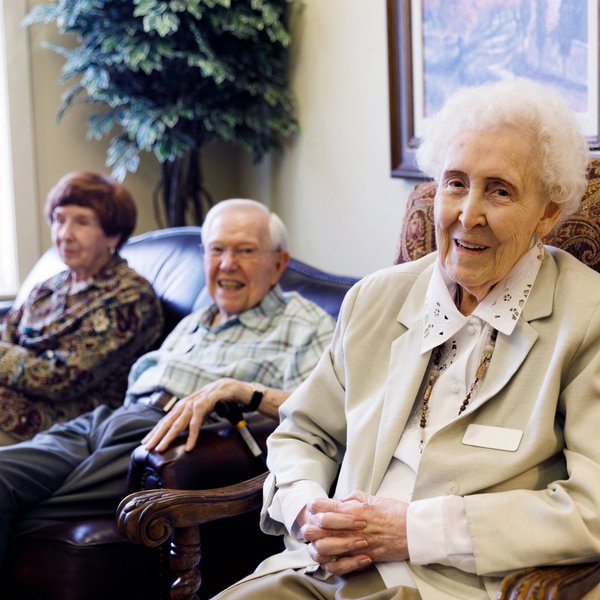 Legacy Oaks of Midlothian | Seated seniors smiling at Arabella of Athens