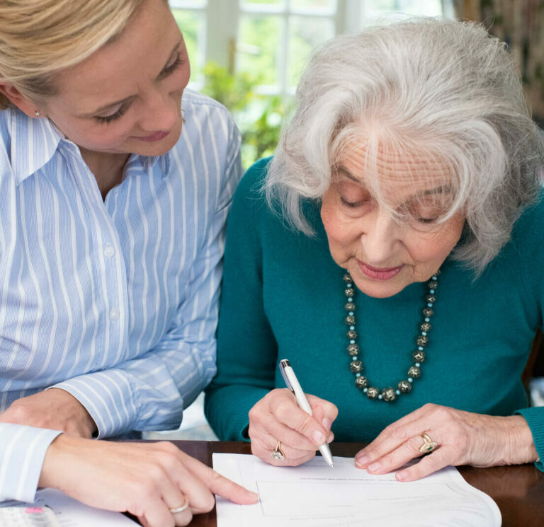 Civitas Senior Living | Senior signing a document