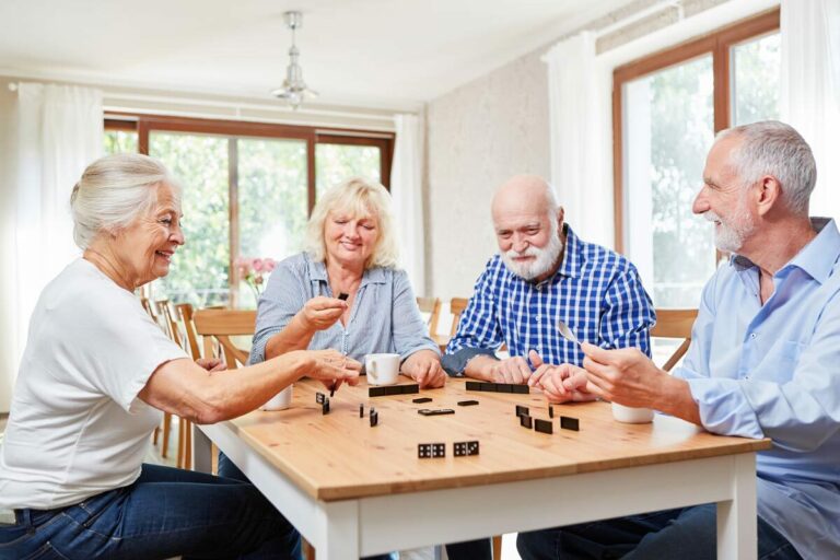 Civitas Senior Living | Seniors playing dominoes