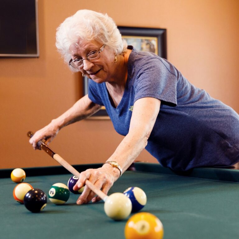 Long Creek | Senior woman playing billiards