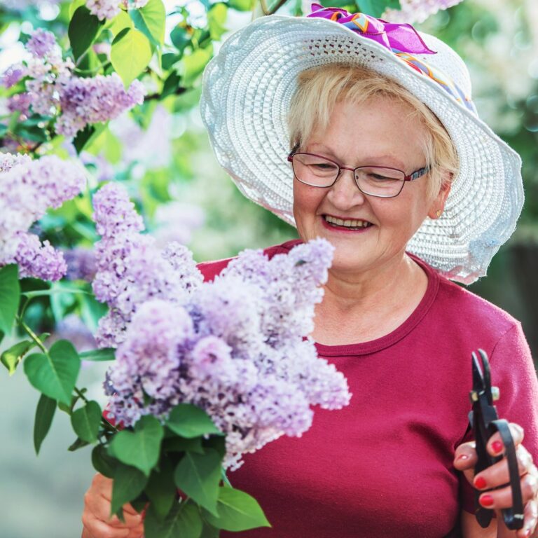 Long Creek | Senior woman cutting flowers outdoors