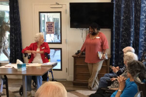 Long Creek | Executive Director, Latosha Rotimi spending time with senior residents