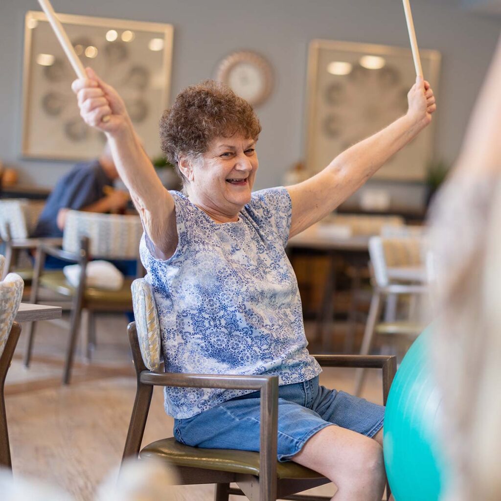 StoneCreek of Copperfield | Senior woman enjoys cardio drumming