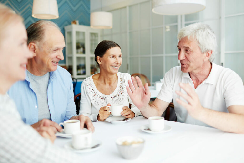 StoneCreek of Copperfield | Happy seniors having conversation over coffee